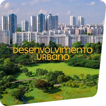 Imagem aérea com vista de fundo de prédios e na frente uma ampla área verde de um parque no centro da smart cidade. 